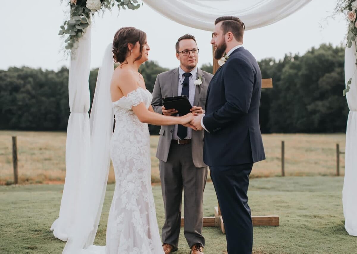 Couple getting married while Justin officiates