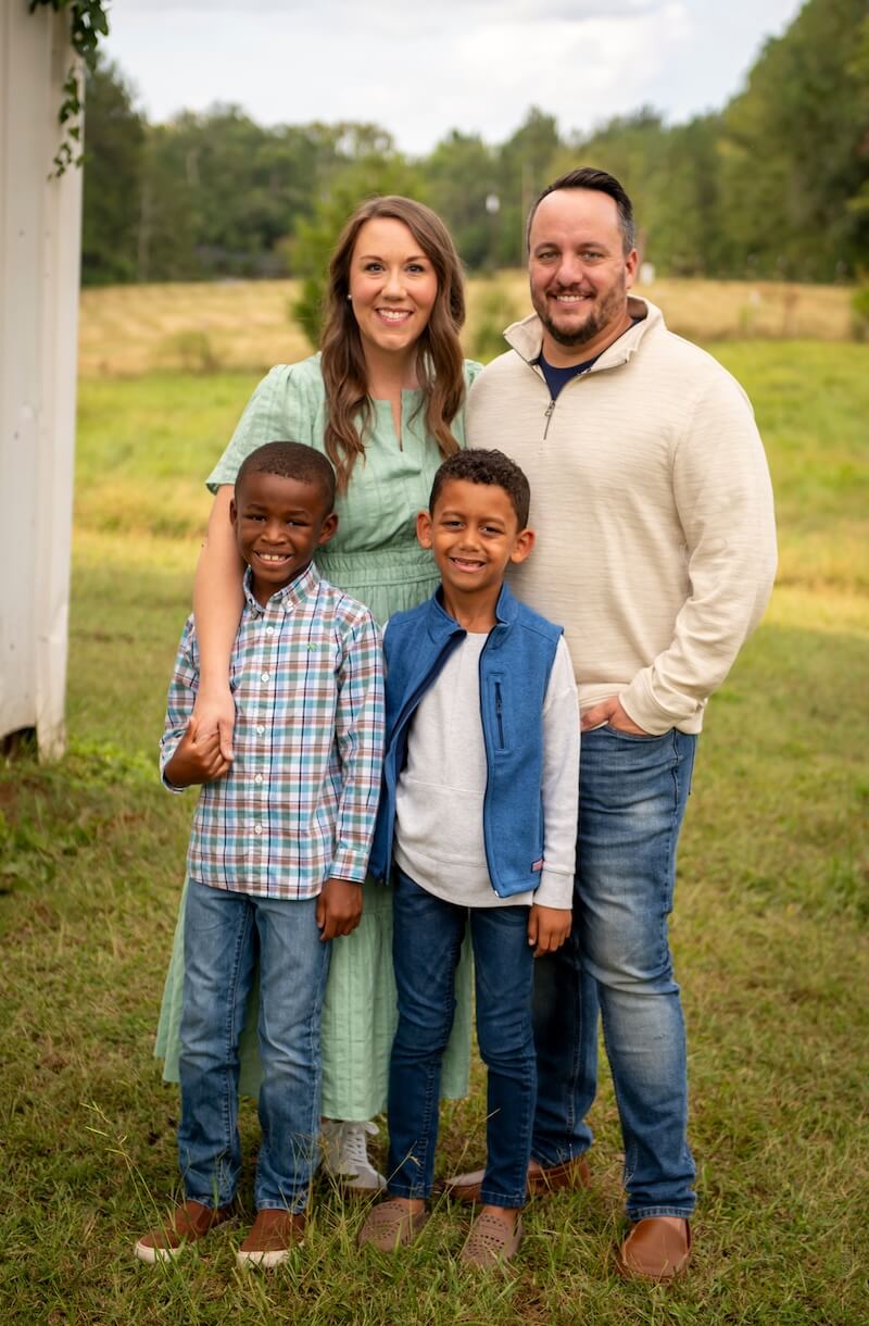 Justin Woelk with his wife and their two sons